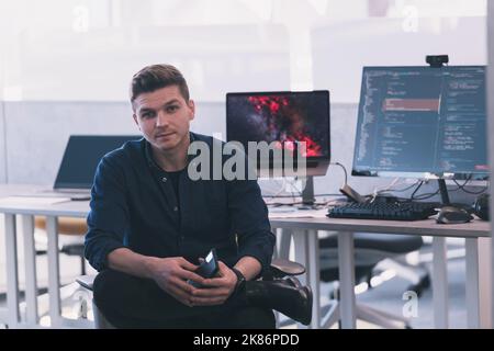 Programming. Man Working On Computer In IT Office, Sitting At Desk Writing Codes. Programmer Typing Data Code, Working On Project In Software Stock Photo
