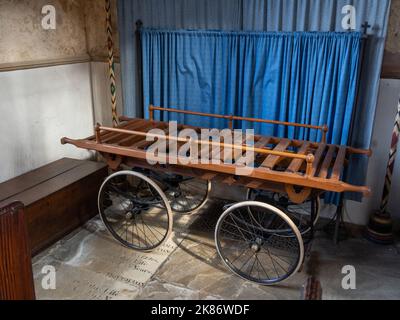 Hand drawn funeral bier inside the church of St Mary and All Saints, Holcot, Northamptonshire, UK Stock Photo