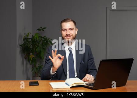 Professional  businessman is feeling ok with his work Stock Photo