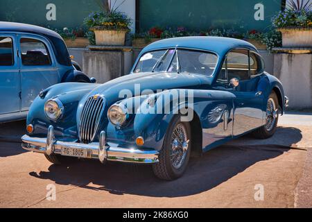 BADEN BADEN, GERMANY - JULY 2022: blue 1955 Jaguar XK140 Fixed Head Coupe, oldtimer meeting in Kurpark. Stock Photo
