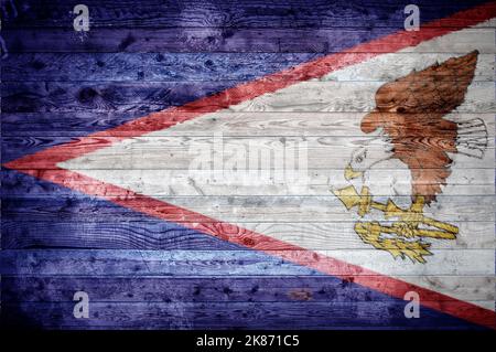 A vignetted background image of the flag of American Samoa painted onto wooden boards of a wall or floor. Stock Photo