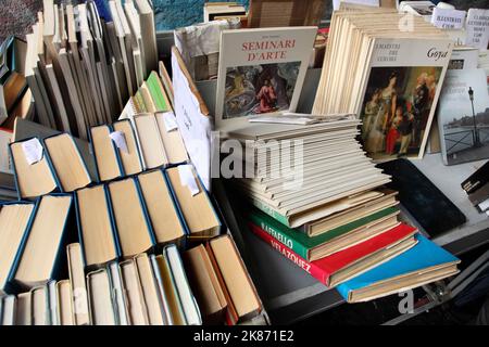 Selection of Italian-language art books on sale at secondhand stall. Stock Photo