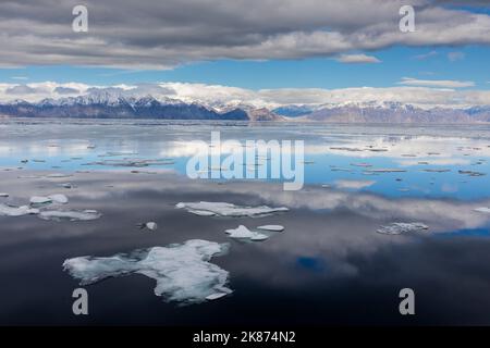 A view of the snow covered mountains surrounding Pond Inlet, Nunavut, Canada, North America Stock Photo