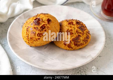 Turkish black cumin pogaca. Traditional flavors. Pogaca on gray background. close up Stock Photo