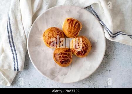 Turkish little pogaca. Traditional flavors. Pogaca on gray background. Top view Stock Photo