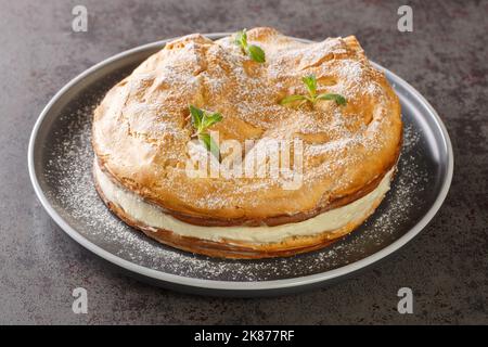 Karpatka is an easy Polish Carpathian cream cake dessert closeup on the plate on the table. Horizontal Stock Photo