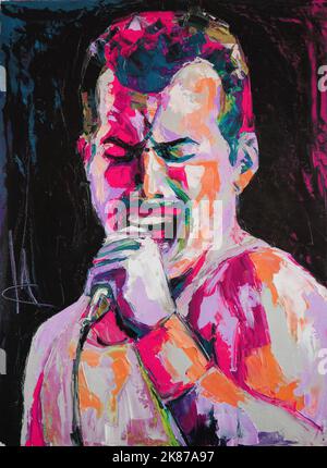 Oil portrait painting in multicolored tones. Portrait of singing Freddie Mercury. Conceptual closeup of an oil painting and palette knife on canvas. Stock Photo