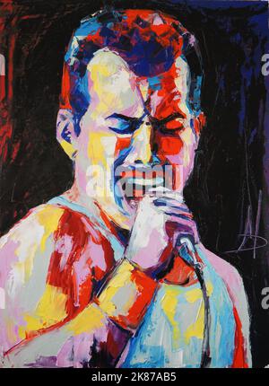 Oil portrait painting in multicolored tones. Portrait of singing Freddie Mercury. Conceptual closeup of an oil painting and palette knife on canvas. Stock Photo