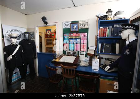 Cumnock, Ayrshire, Scotland, UK Jim Manson (80) a former Police officer with his collection of Police Memorbilia from Strathcylde & Lanarkshire Constabulary. Inside a rented industrial unit he has created a mini Police station complete with prison cell Stock Photo