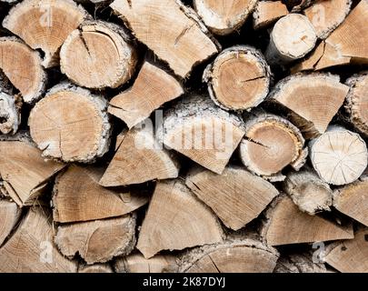 High quality firewood background. Front view with copy space. Stock Photo