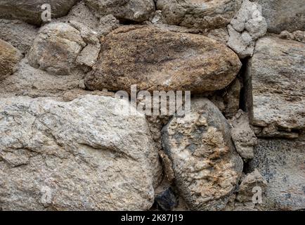 High quality old stone wall  background. Front view with copy space. Stock Photo