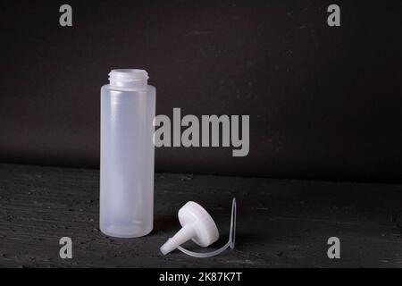 plastic sauce bottle on a black background Stock Photo