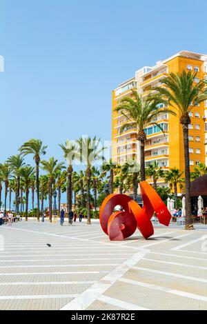 Seafront square with palm trees and contemporary sculpture at Avenue Duque de Najera, Cadiz, Andalusia, Spain Stock Photo