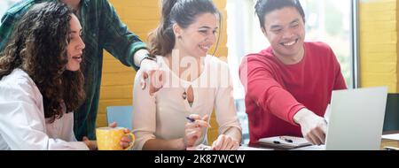 Horizontal banner or header with young co-workers multiethnic team planning a new startup - Bright filter with focus on woman face at center Stock Photo