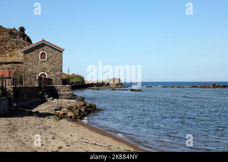 Small picturesque stone house by the sea. Lesbos. September / October 2022. Autumn. Stock Photo