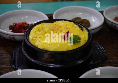 This is the traditional Korean-style steamed egg with different Kimchi as the side dishes. It is the side dish of the well-known Jeonju Bibimbap. Stock Photo