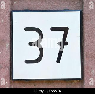 A close up of a house number 37 Stock Photo