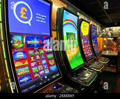 Tempting fruit machines for gamblers at Frankley Services M5 south, West Midlands, England, UK Stock Photo