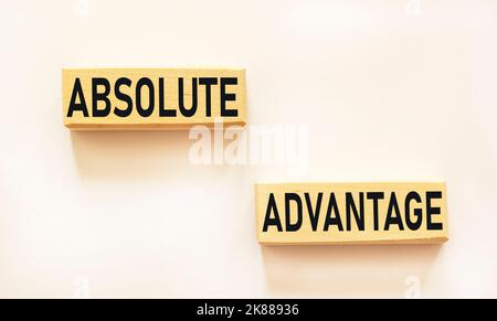 Absolute advantage offer written on wooden blocks and white background .Economy and concept Stock Photo
