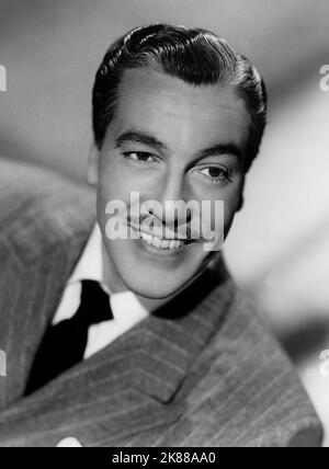 Cesar Romero  Actor   01 May 1945   **WARNING** This Photograph is for editorial use only and is the copyright of The Film Company and/or the Photographer assigned by the Film or Production Company and can only be reproduced by publications in conjunction with the promotion of the above Film. A Mandatory Credit To The Film Company is required. The Photographer should also be credited when known. No commercial use can be granted without written authority from the Film Company. Stock Photo