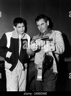 Peter Ford & Glenn Ford  Actor With Son   01 May 1958   **WARNING** This Photograph is for editorial use only and is the copyright of The Film Company and/or the Photographer assigned by the Film or Production Company and can only be reproduced by publications in conjunction with the promotion of the above Film. A Mandatory Credit To The Film Company is required. The Photographer should also be credited when known. No commercial use can be granted without written authority from the Film Company. Stock Photo