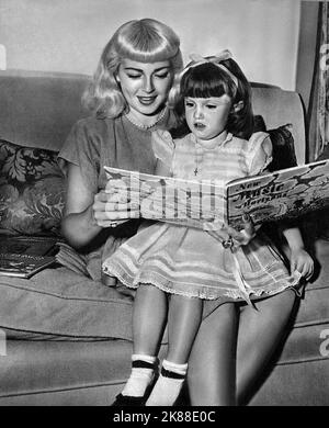 Lana Turner & Cheryl Crane  Actress With Daughter   01 May 1947   **WARNING** This Photograph is for editorial use only and is the copyright of The Film Company and/or the Photographer assigned by the Film or Production Company and can only be reproduced by publications in conjunction with the promotion of the above Film. A Mandatory Credit To The Film Company is required. The Photographer should also be credited when known. No commercial use can be granted without written authority from the Film Company. Stock Photo