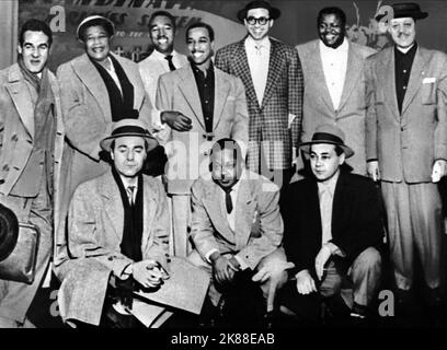 Gene Krupa, Ella Fitzgerald, Ray Brown, J.C. Heard, Barney Kessel, Oscar Peterson, Lester Young, Flip Phillips, Charlie Shavers & Willie Smith  Jazz At The Philmarmonic   01 June 1953   **WARNING** This Photograph is for editorial use only and is the copyright of The Film Company and/or the Photographer assigned by the Film or Production Company and can only be reproduced by publications in conjunction with the promotion of the above Film. A Mandatory Credit To The Film Company is required. The Photographer should also be credited when known. No commercial use can be granted without written au Stock Photo