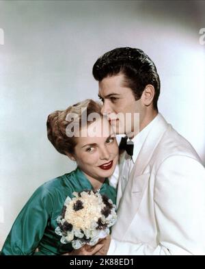 Janet Leigh & Tony Curtis  Married Actor & Actress   01 May 1954   **WARNING** This Photograph is for editorial use only and is the copyright of The Film Company and/or the Photographer assigned by the Film or Production Company and can only be reproduced by publications in conjunction with the promotion of the above Film. A Mandatory Credit To The Film Company is required. The Photographer should also be credited when known. No commercial use can be granted without written authority from the Film Company. Stock Photo