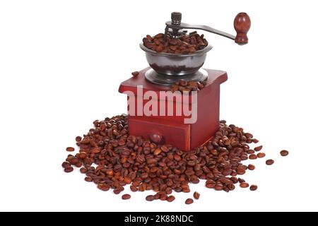 Manual coffee grinder in a heap of a coffee beans Stock Photo