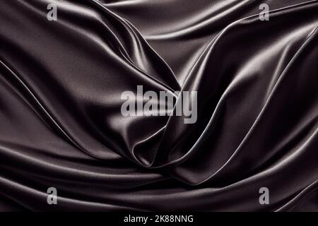 Black Silk Background. Beautiful black satin fabric texture with light wavy folds. Luxury and aesthetic deep black satin background. Stock Photo