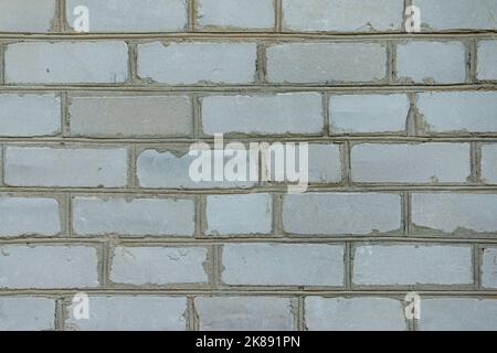 White brick wall made from used material. Abstract texture background image Stock Photo