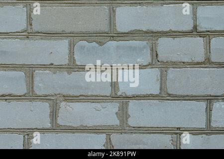 White brick wall made from used material. Abstract texture background image Stock Photo
