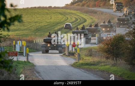 two sections of British army FV4034 Challenger 2 ii main battle tanks at a main road junction crossing, Wiltshire UK Stock Photo