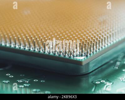 Macro photo of hard disk controller board and Central Computer Processor. CPU on green background. IT detail in computer. Technological detail of pers Stock Photo