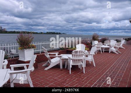 Adirondack chairs on the patio with a view of  Lake Michigan Milwaukee Wisconsin Stock Photo