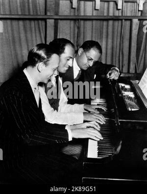 Fred Astaire, George Gershwin, Ira Gershwin, at rehearsal for the film, 'Shall We Dance', RKO Radio Pictures, 1937 Stock Photo