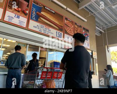 Beijing, Hebei, China. 15th Oct, 2022. Customers wait in line to order below signage for the Costco Kirkland Signature $1.50 hot dog and soda combo, which has maintained the same price since 1985 despite consumer price increases and inflation, at the food court outside a Costco Wholesale Corp. store in San Jose, California. (Credit Image: © David G. McIntyre/ZUMA Press Wire) Stock Photo