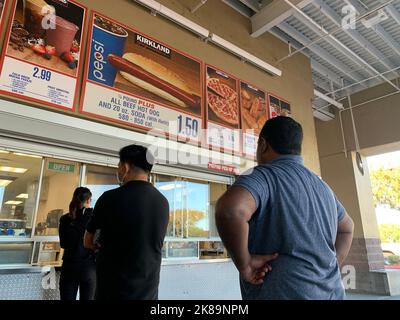 Beijing, Hebei, China. 15th Oct, 2022. Customers wait in line to order below signage for the Costco Kirkland Signature $1.50 hot dog and soda combo, which has maintained the same price since 1985 despite consumer price increases and inflation, at the food court outside a Costco Wholesale Corp. store in San Jose, California. (Credit Image: © David G. McIntyre/ZUMA Press Wire) Stock Photo