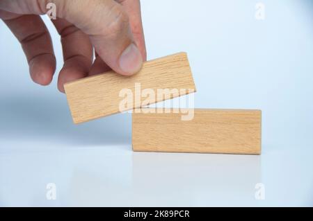 Hand holding wooden block with customizable space for text or ideas. Copy space. Stock Photo