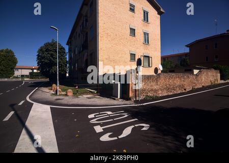 Corner  of a street with stop sign on the ground in a residential area Stock Photo