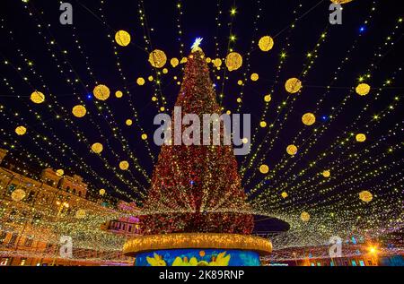 The Main Christmas Tree in bright decorations and lighting garlands decorate Sophia Square of Kyiv, Ukraine Stock Photo