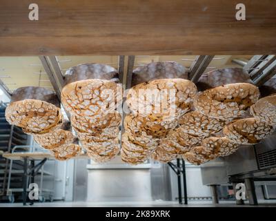 panettone cooking secrets concept hanging up down in the kitchen Stock Photo