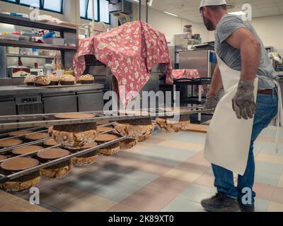 panettone cooking secrets concept hanging up down in the kitchen Stock Photo