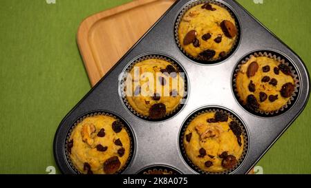 Chocolate chip muffin cup cake closeup isolated on black background. Stock Photo