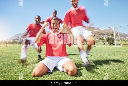 Man, soccer and team winner in celebration for sports victory, score or goal on the field outdoors. Happy male football players celebrating win Stock Photo