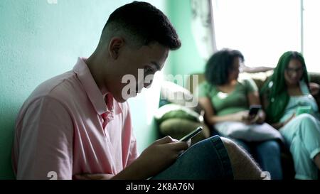 One hispanic man reading shocking news on cellphone. Person receiving unbelievable message notification Stock Photo