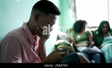 One hispanic man reading shocking news on cellphone. Person receiving unbelievable message notification Stock Photo