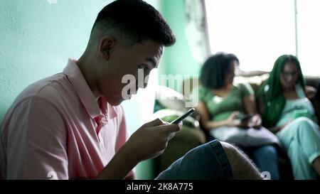 One hispanic man reading shocking news on cellphone. Person receiving unbelievable message notification Stock Photo