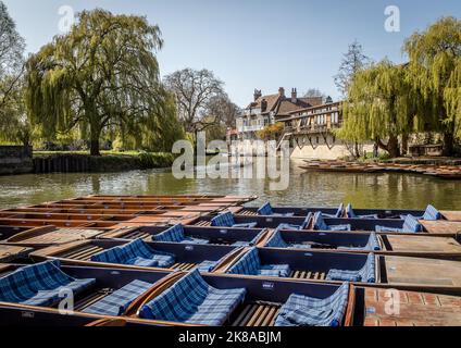 Punts lined up waiting for hire on the River Cam in Cambridge