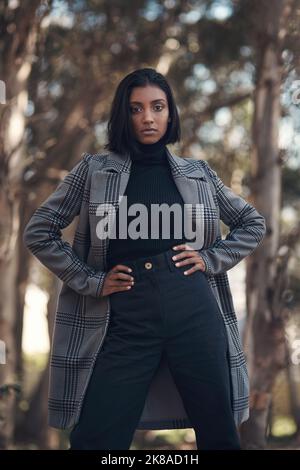 You already have what it takes. a fashionable young woman posing against a nature background. Stock Photo